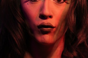 Drag queen making a face like she just ate something sour